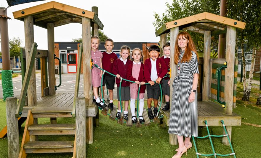 Hannah Gray with children climbing.jpg